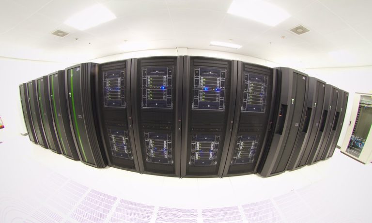 Rows of supercomputer cabinets inside a high-performance computing centre