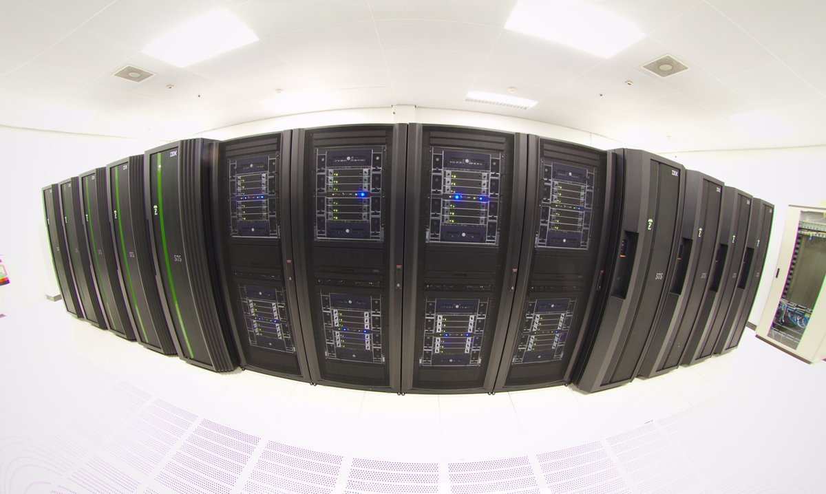 Rows of supercomputer cabinets inside a high-performance computing centre