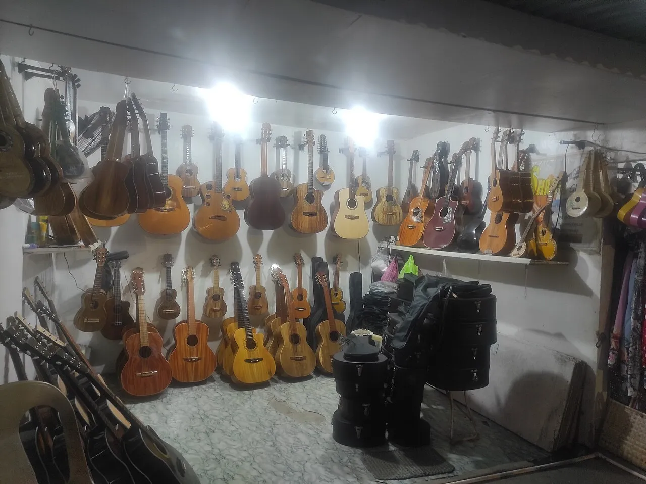 The interior of a small guitar and ukulele shop.